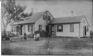 Home of Phineas & Emma Gibbs at 954 County Rd, Cataumet, showing, L to R, Seabury, Mabel, Sylvia & Emma. (Abt 1888)